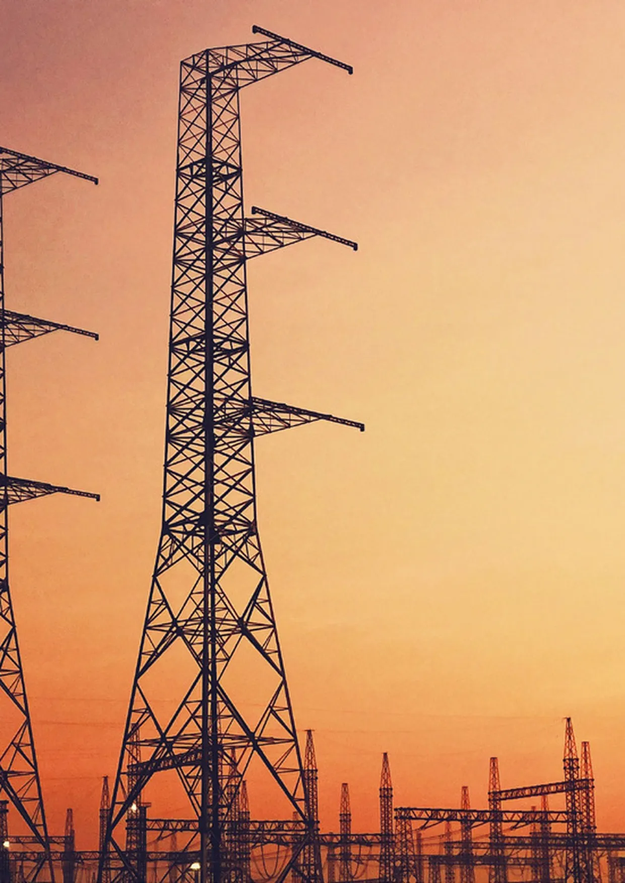 Power transmission infrastructure at dusk.