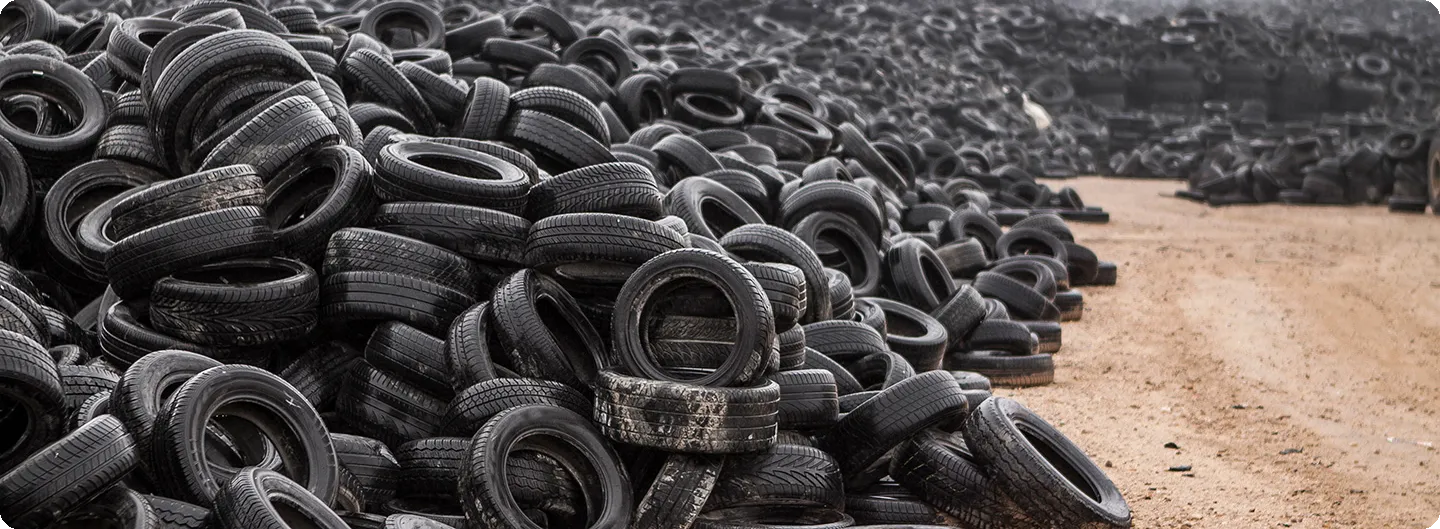 A stockpile of end-of-life tires awaiting processing.